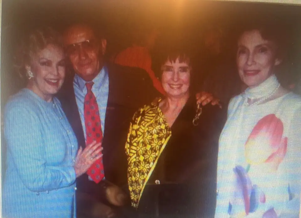 Nate Waxman with Margaret O'Brien, June Haver and Joan Leslie; Margaret wears a gold Swoboda statement piece