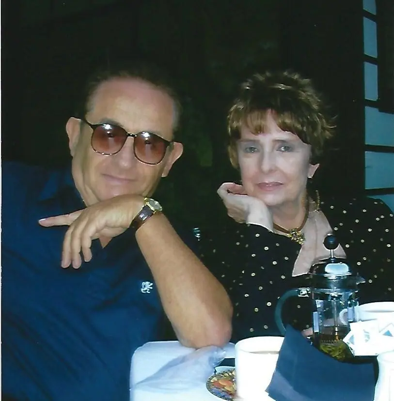 Nate Waxman and Margaret O'Brien at an outdoor lunch table; she wears a gold Swoboda necklace