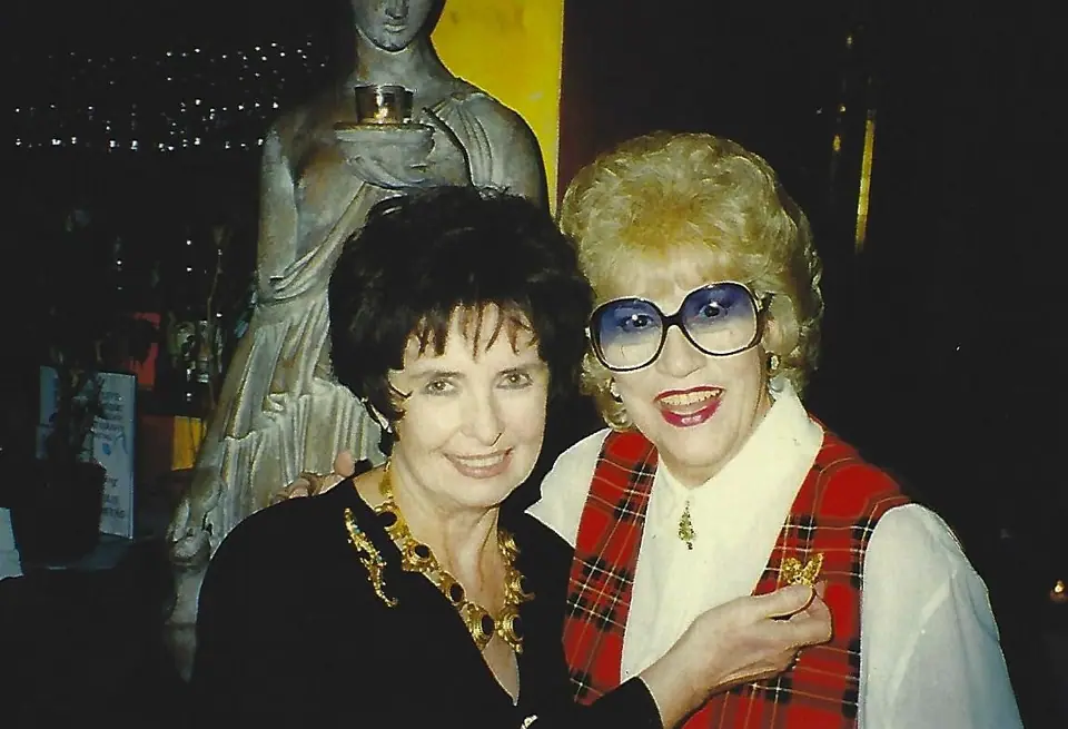 Margaret O'Brien in a gold Swoboda necklace with Patty Andrews in a red plaid vest